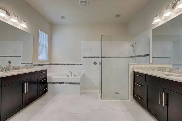 a view of a hallway with wooden floor and a window