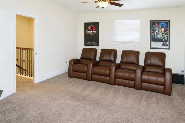 a front view of a house with a yard and palm trees