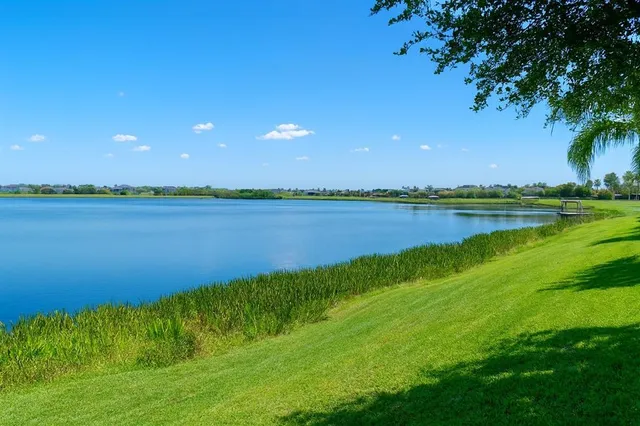 a view of a lake with a big yard
