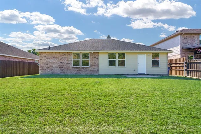 a view of a house with a garden