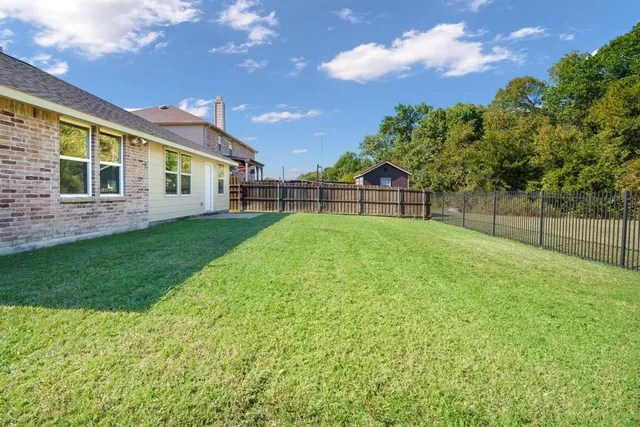 a view of a backyard with a garden