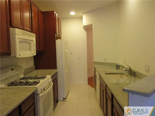 a kitchen that has a sink and a stove