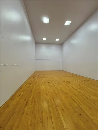 a room with gym equipment and a large window