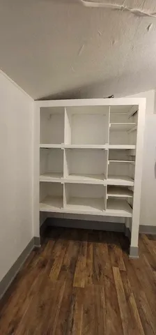 a view of balcony with wooden floor and fence