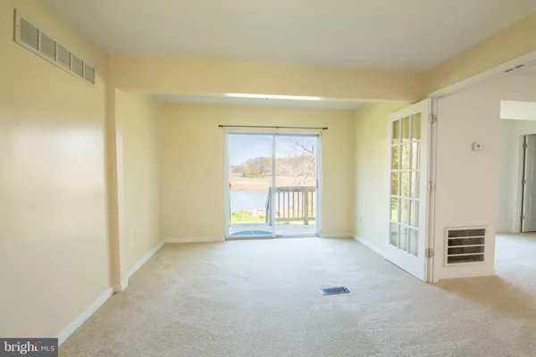 a view of an empty room and window