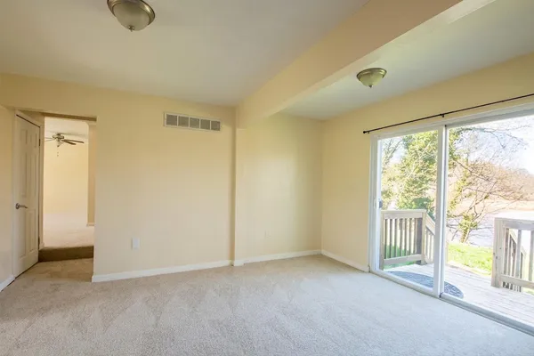 a bathroom with a toilet sink and a window