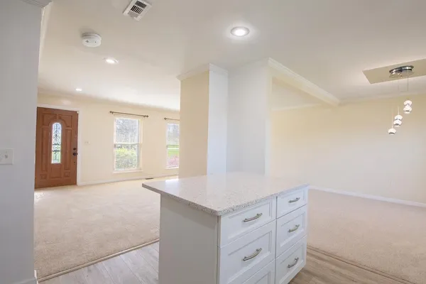 a view of a kitchen with refrigerator and microwave