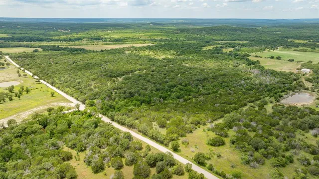 a view of a large yard with an outdoor space