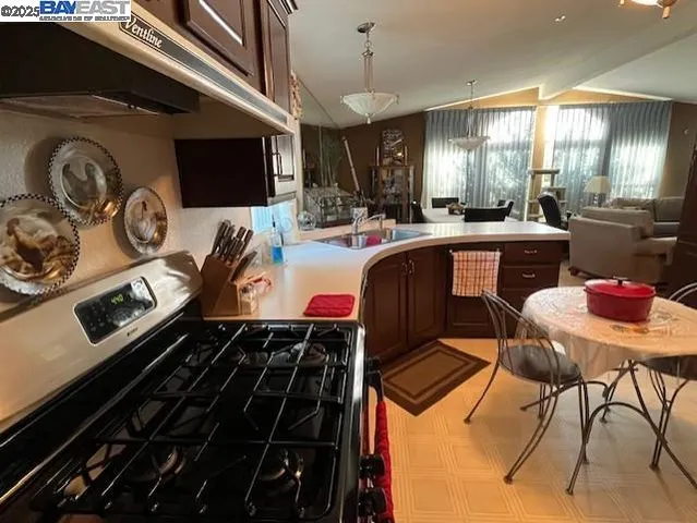 a kitchen with table and chairs