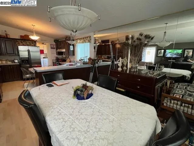 a kitchen with a table and chairs