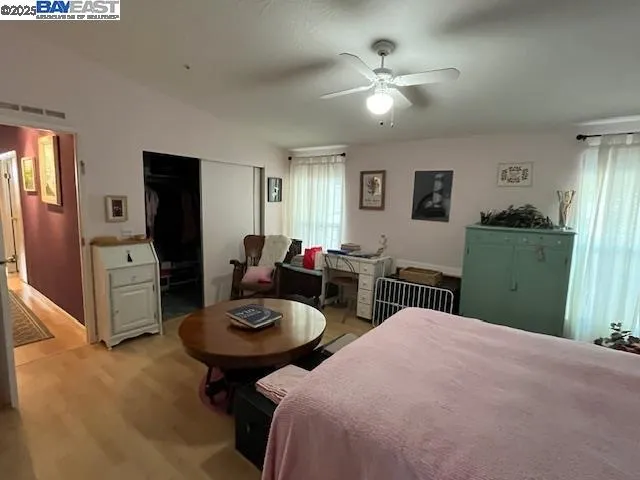 a bed room with furniture and a chandelier