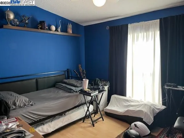 a bedroom with a bed and a chair