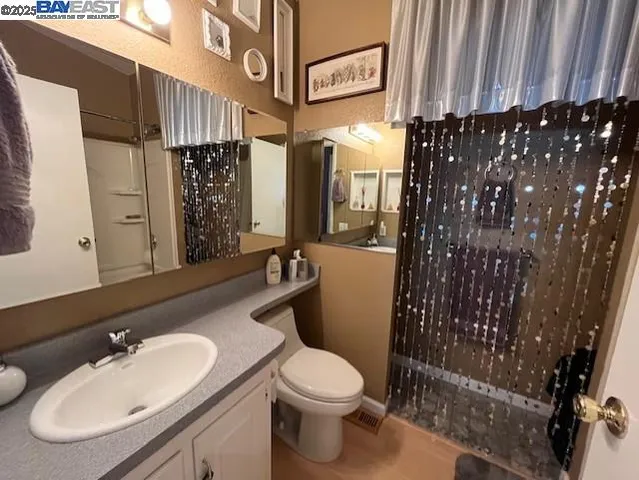 a bathroom with a shower curtain and a bathtub