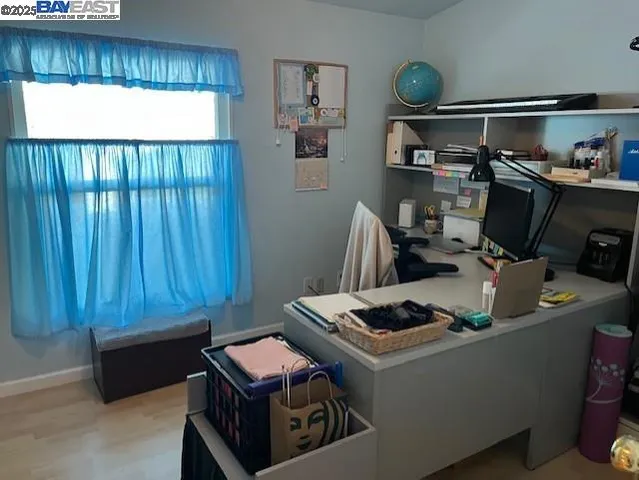 a workspace with furniture and window