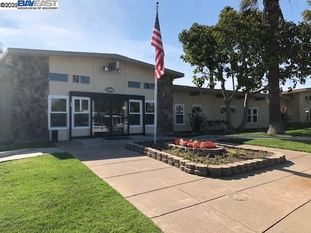 a view of a dining room with furniture and window