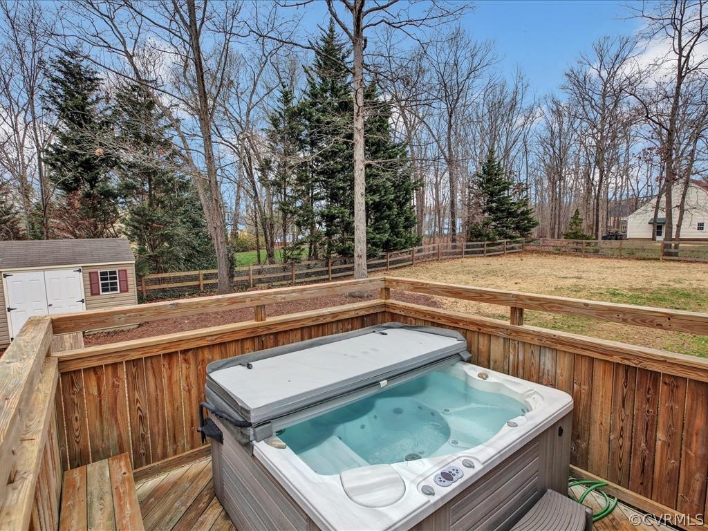 2010 Corner Rock Road Midlothian, VA 23113 - Photo 23 of 27 a view of a backyard with a large tree and wooden fence