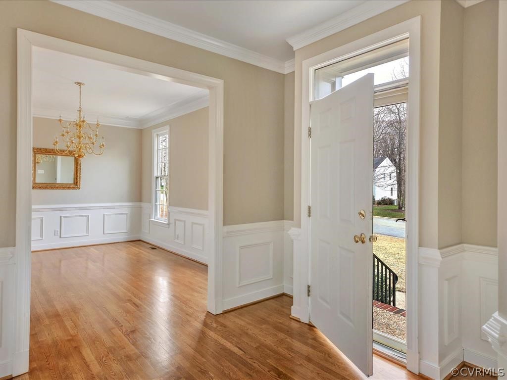 2010 Corner Rock Road Midlothian, VA 23113 - Photo 4 of 27 a view of an entryway with wooden floor and a bedroom