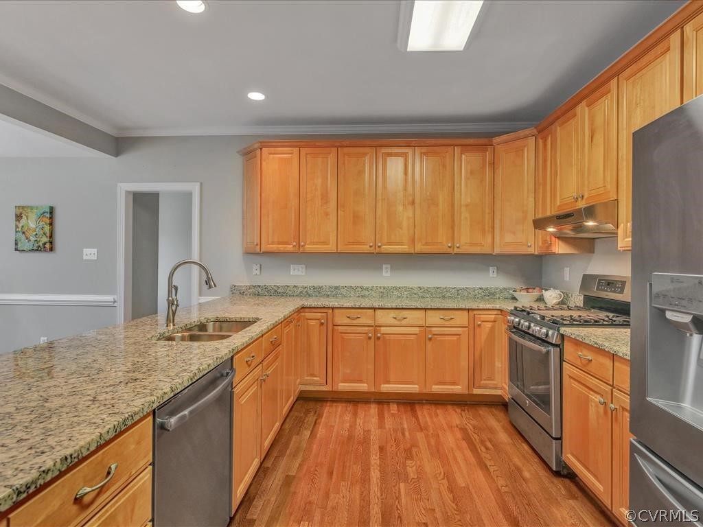 2010 Corner Rock Road Midlothian, VA 23113 - Photo 8 of 27 a kitchen with stainless steel appliances granite countertop wooden cabinets and a stove top oven
