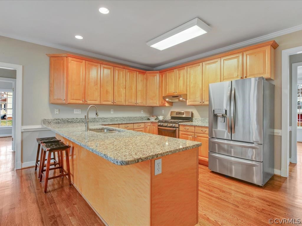 2010 Corner Rock Road Midlothian, VA 23113 - Photo 10 of 27 a kitchen with stainless steel appliances granite countertop a refrigerator a sink dishwasher and a stove with wooden floor
