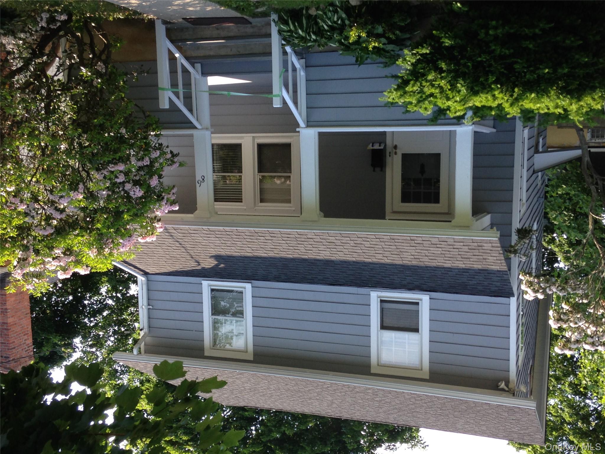 86 Brown Road Scarsdale, NY 10583 - Photo 1 of 17 a view of a house with a yard