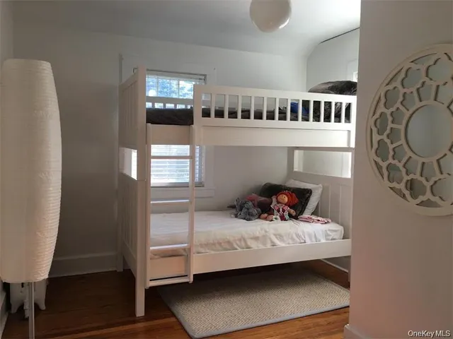 a bedroom with furniture and a window