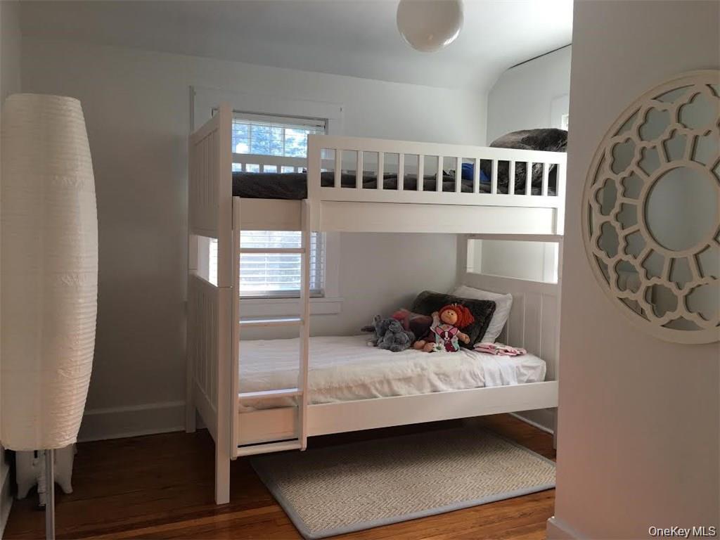 86 Brown Road Scarsdale, NY 10583 - Photo 11 of 17 a bedroom with furniture and a window