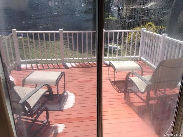 a view of a two chairs in the balcony