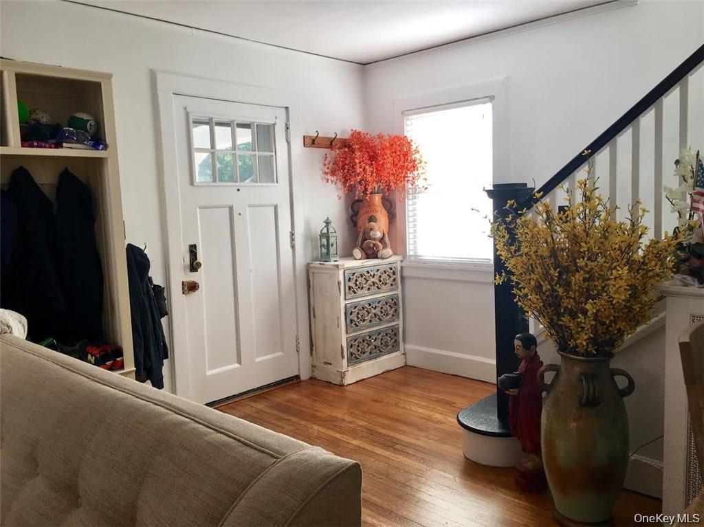 86 Brown Road Scarsdale, NY 10583 - Photo 2 of 17 a livingroom with wooden floor and a flat screen tv
