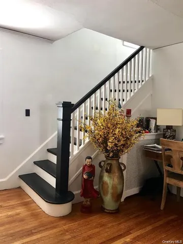 a view of entryway with wooden floor