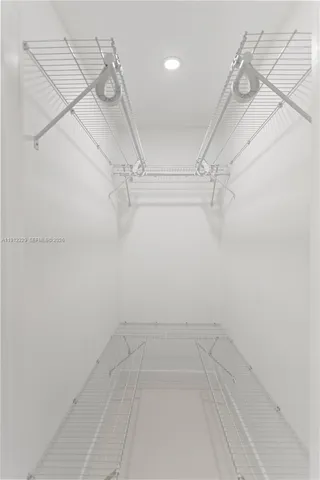 a view of a room with racks on the wall