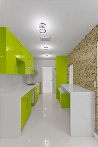 a kitchen with a sink and a stove