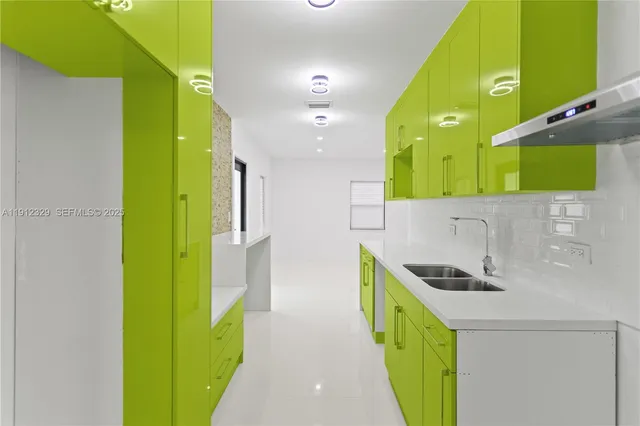 a kitchen that has a sink and a stove