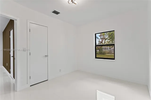 an empty room with windows