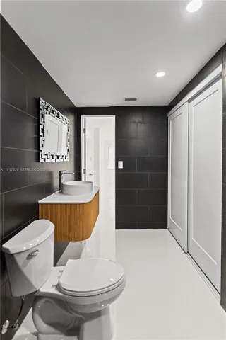 a bathroom with a shower and a toilet
