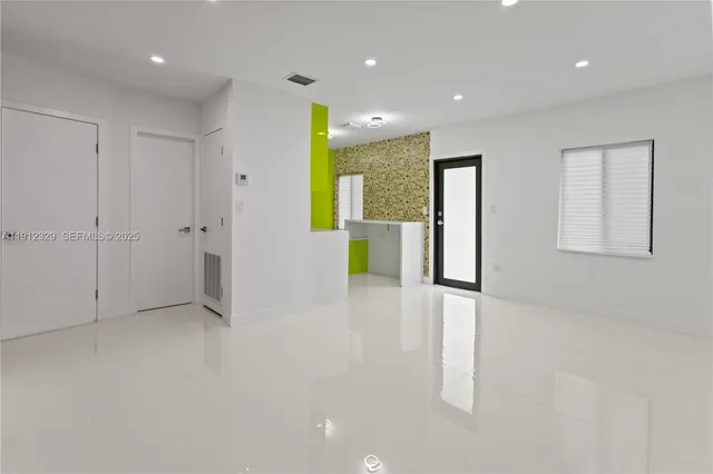 a view of an empty room with a window