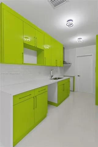 a kitchen with a sink and a microwave
