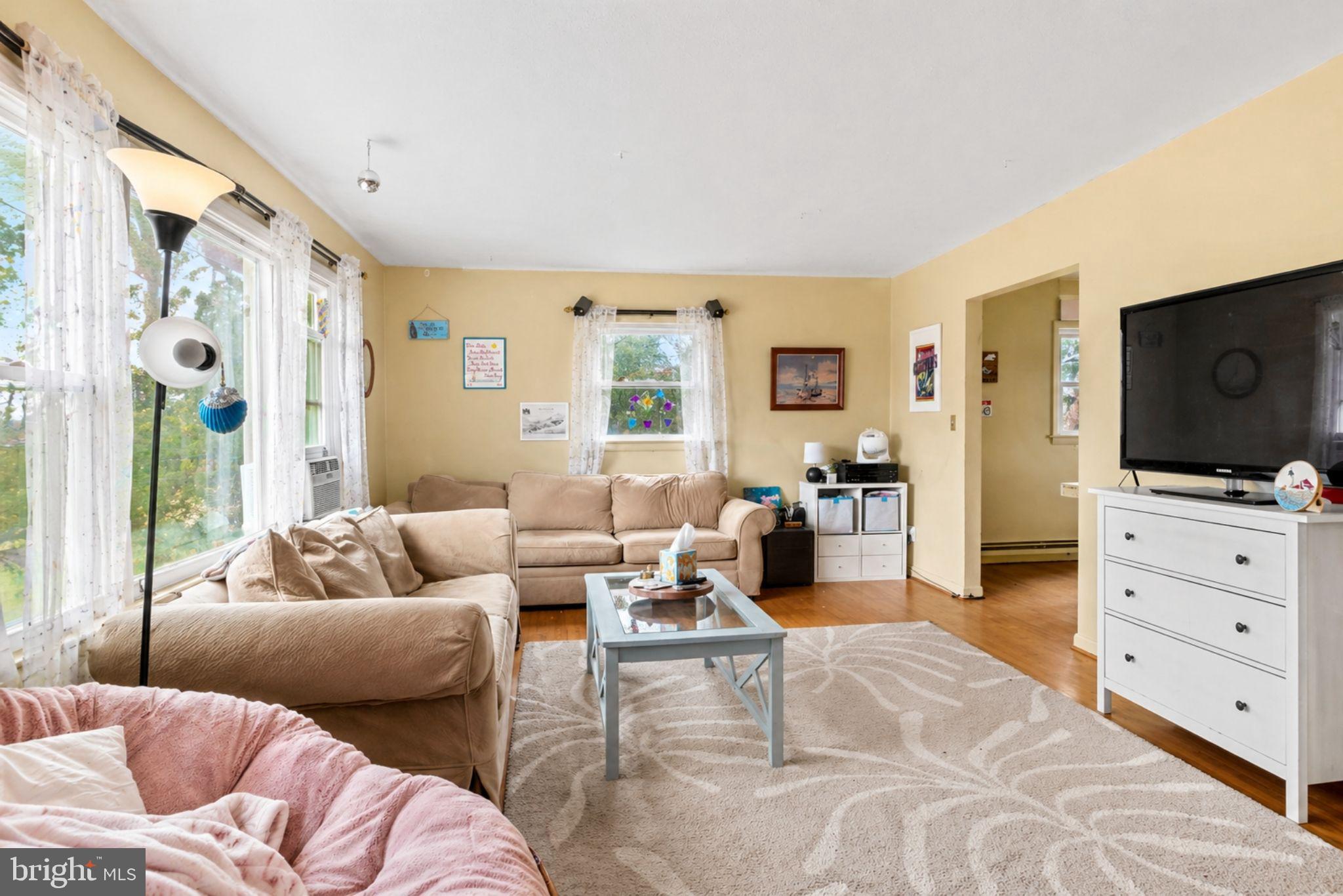 16320 Point Lookout Road Lexington Park, MD 20653 - Photo 6 of 17 a living room with furniture and a flat screen tv