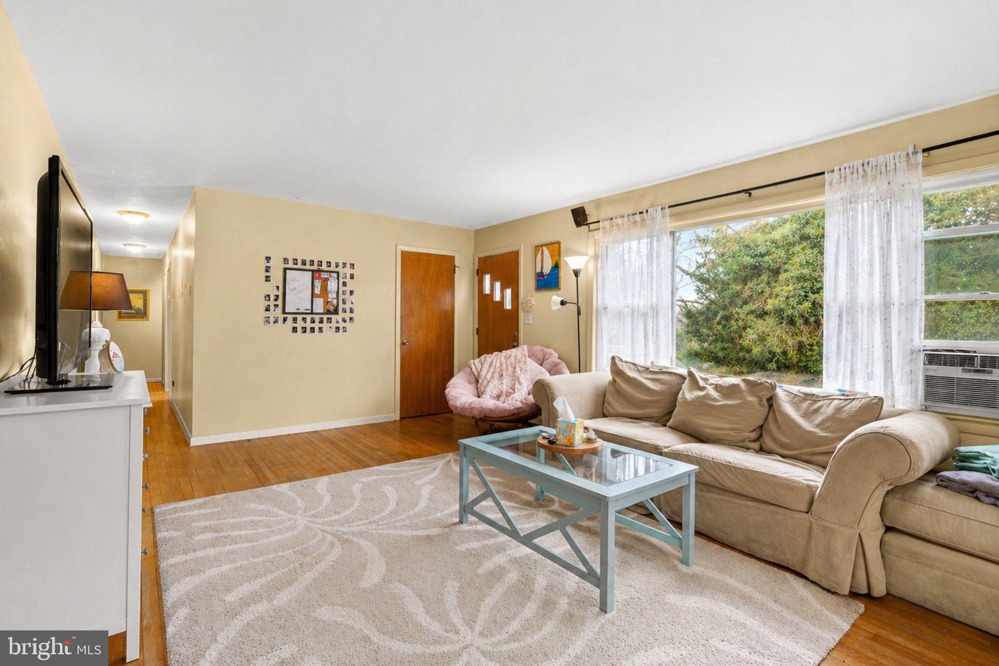 16320 Point Lookout Road Lexington Park, MD 20653 - Photo 7 of 17 a living room with furniture and a large window