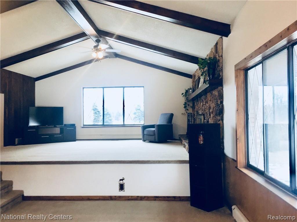 2922 North Lake George Road Dryden, MI 48428 - Photo 22 of 64 View up to Family Room- Open & Airy, spectacular architectural BEAMS; lots of natural light & space