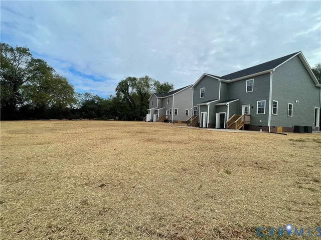 a view of a house with snow on the road