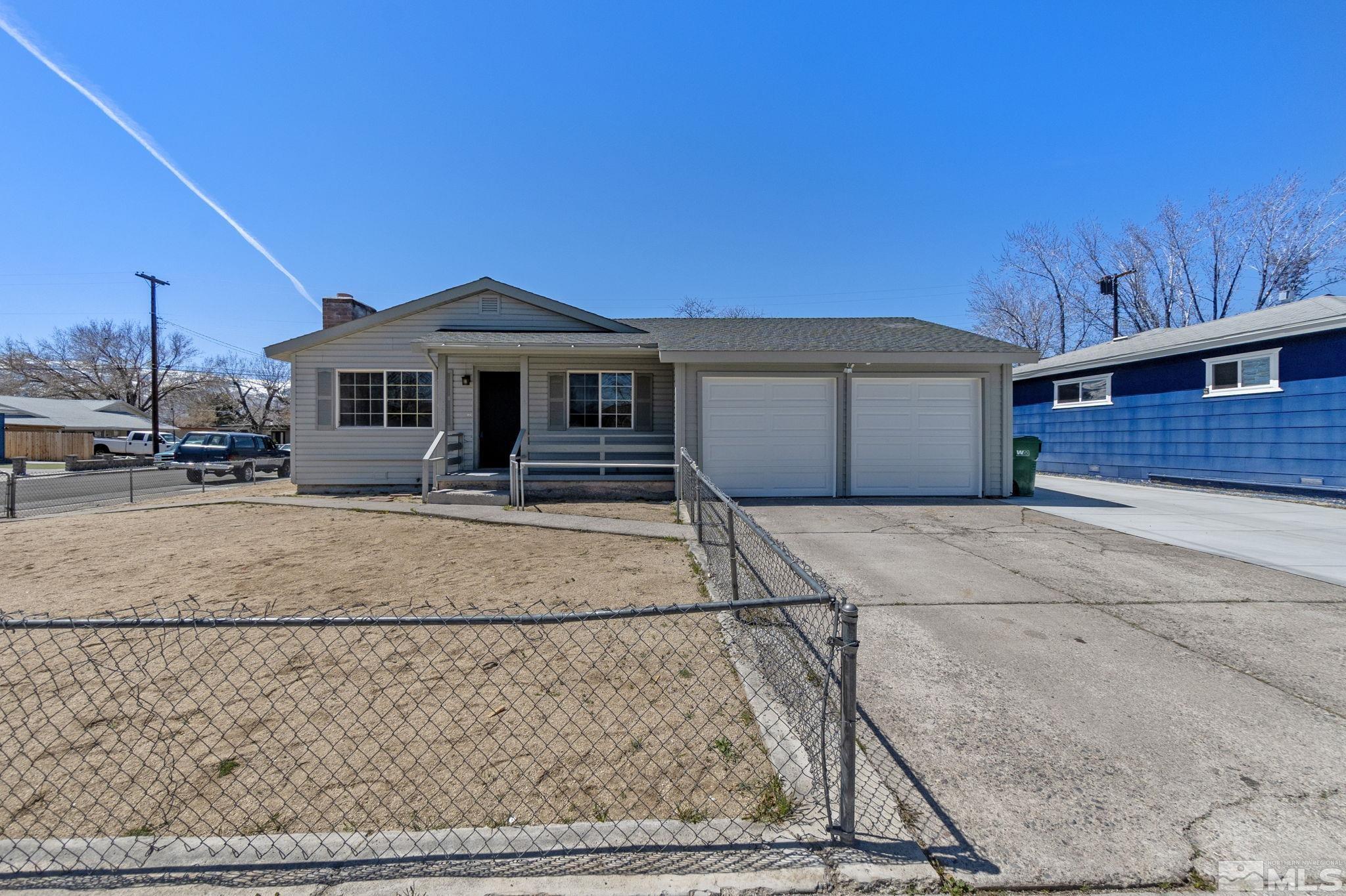 1685 Clemson Road Reno, NV 89502 - Photo 1 of 32 a front view of a house with a yard