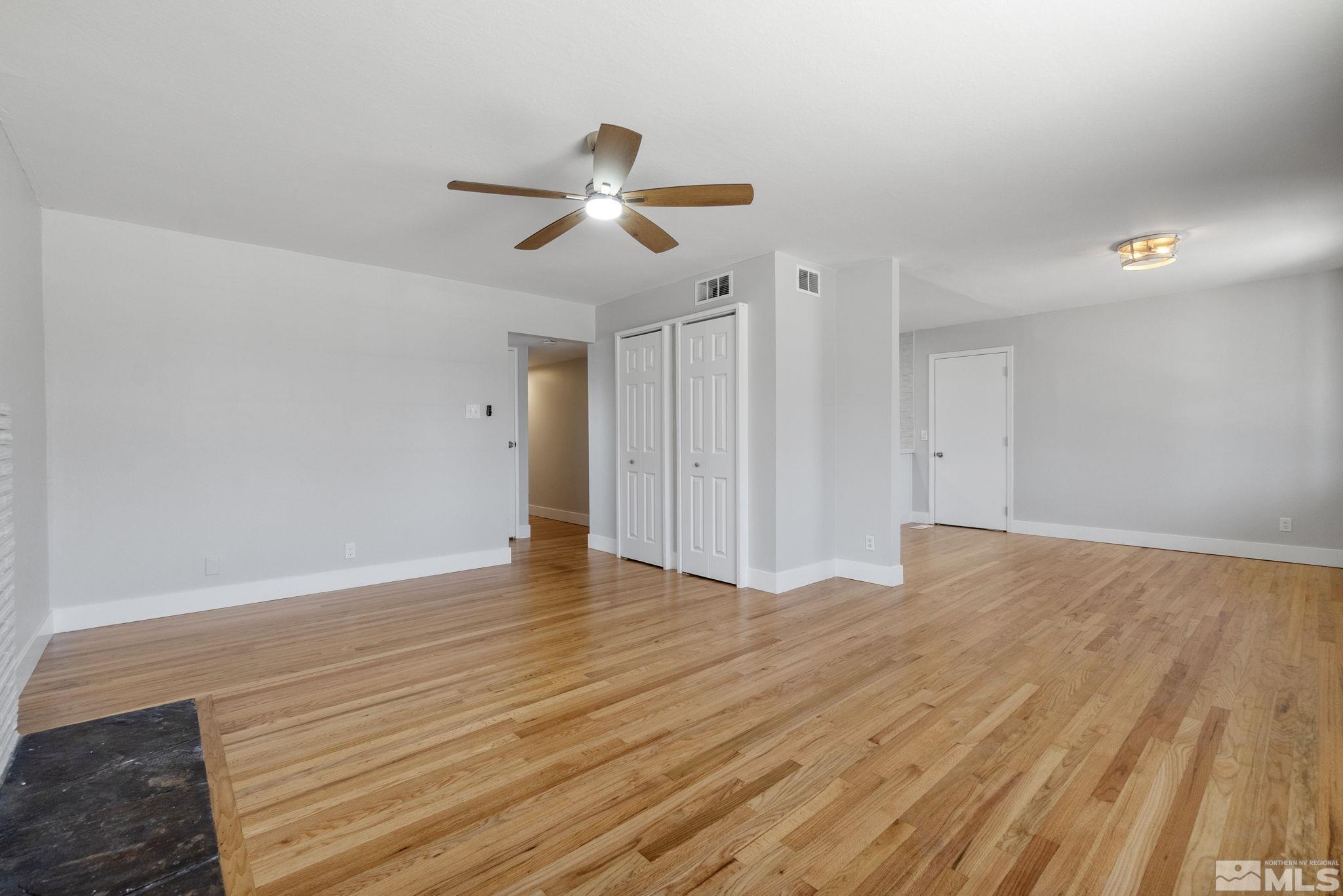 1685 Clemson Road Reno, NV 89502 - Photo 14 of 32 a view of empty room with wooden floor and fan