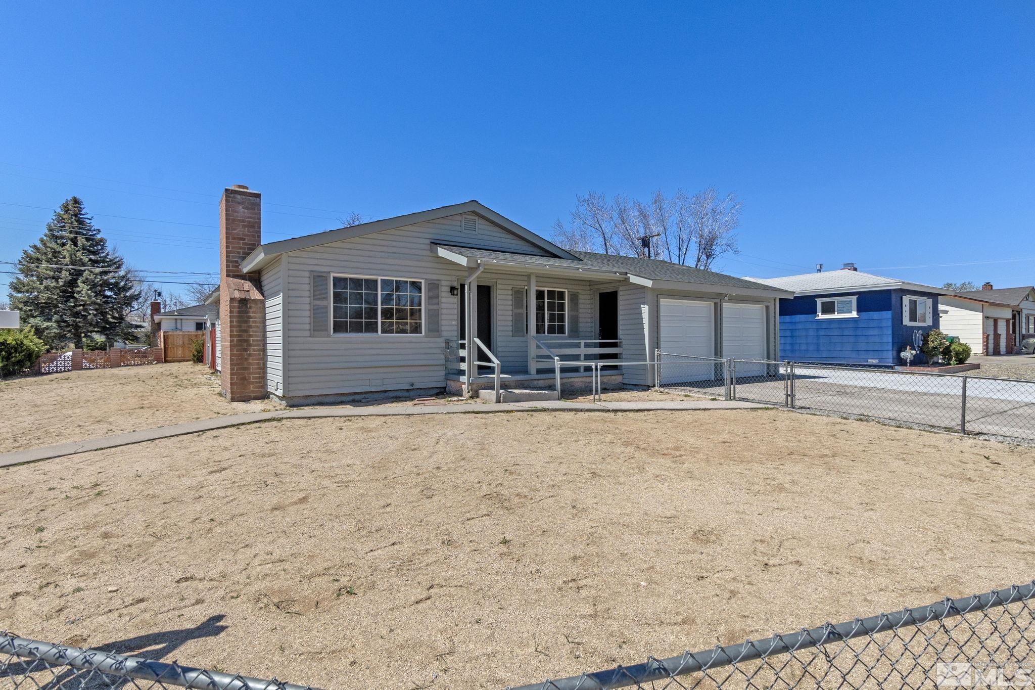 1685 Clemson Road Reno, NV 89502 - Photo 30 of 32 a front view of a house with a yard