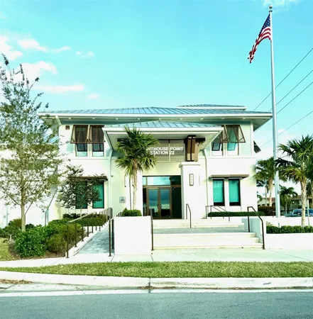a kitchen with a sink stove top oven and cabinets