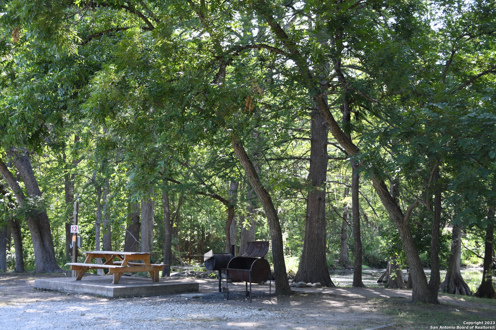 1738 Cave Drive Spring Branch, TX 78070 - Photo 8 of 12 a view of outdoor space with deck and tree