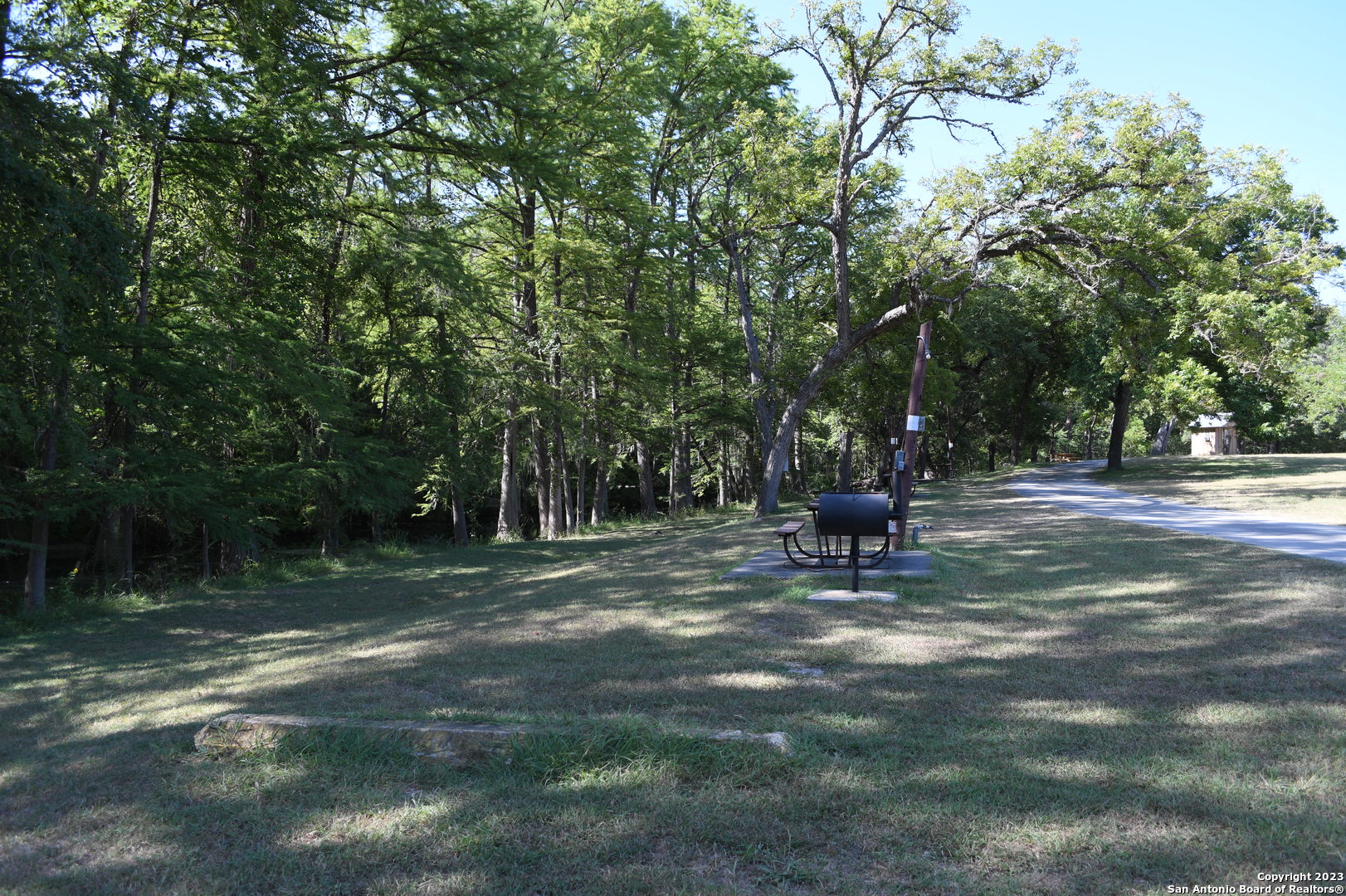 1738 Cave Drive Spring Branch, TX 78070 - Photo 9 of 12 a view of a bench in a garden