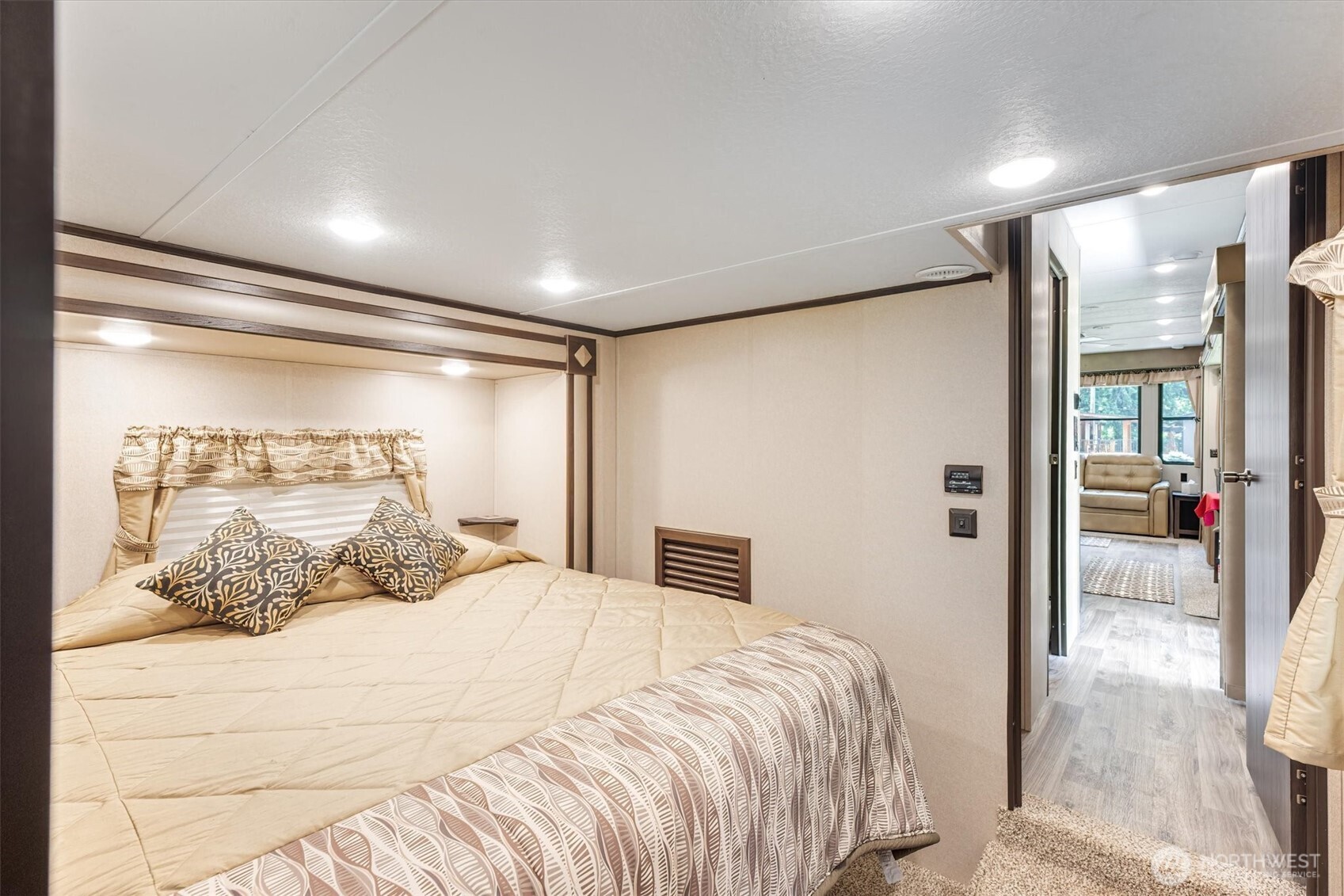 304 Winston Creek Road, Unit B10L3 Mossyrock, WA 98564 - Photo 12 of 30 a bedroom with a large bed and a large mirror