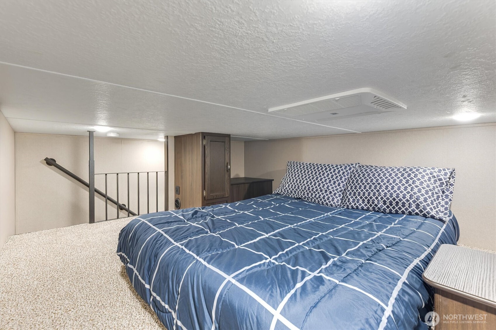 304 Winston Creek Road, Unit B10L3 Mossyrock, WA 98564 - Photo 14 of 30 a bedroom with a bed and a large mirror