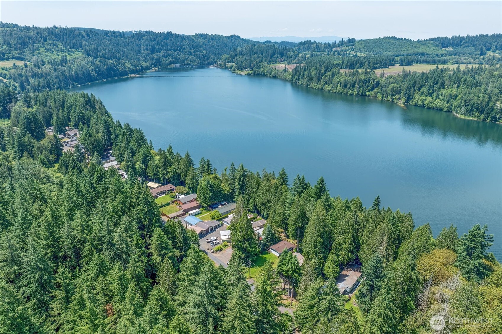 304 Winston Creek Road, Unit B10L3 Mossyrock, WA 98564 - Photo 25 of 30 an aerial view of green landscape with trees houses and lake view