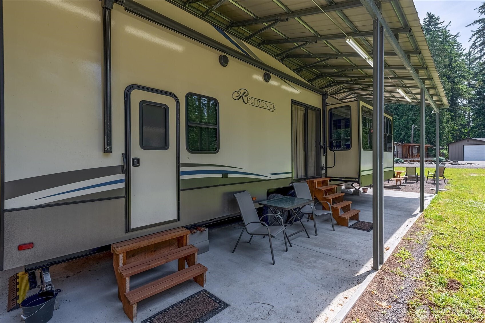 304 Winston Creek Road, Unit B10L3 Mossyrock, WA 98564 - Photo 4 of 30 a view of a porch with chairs and backyard